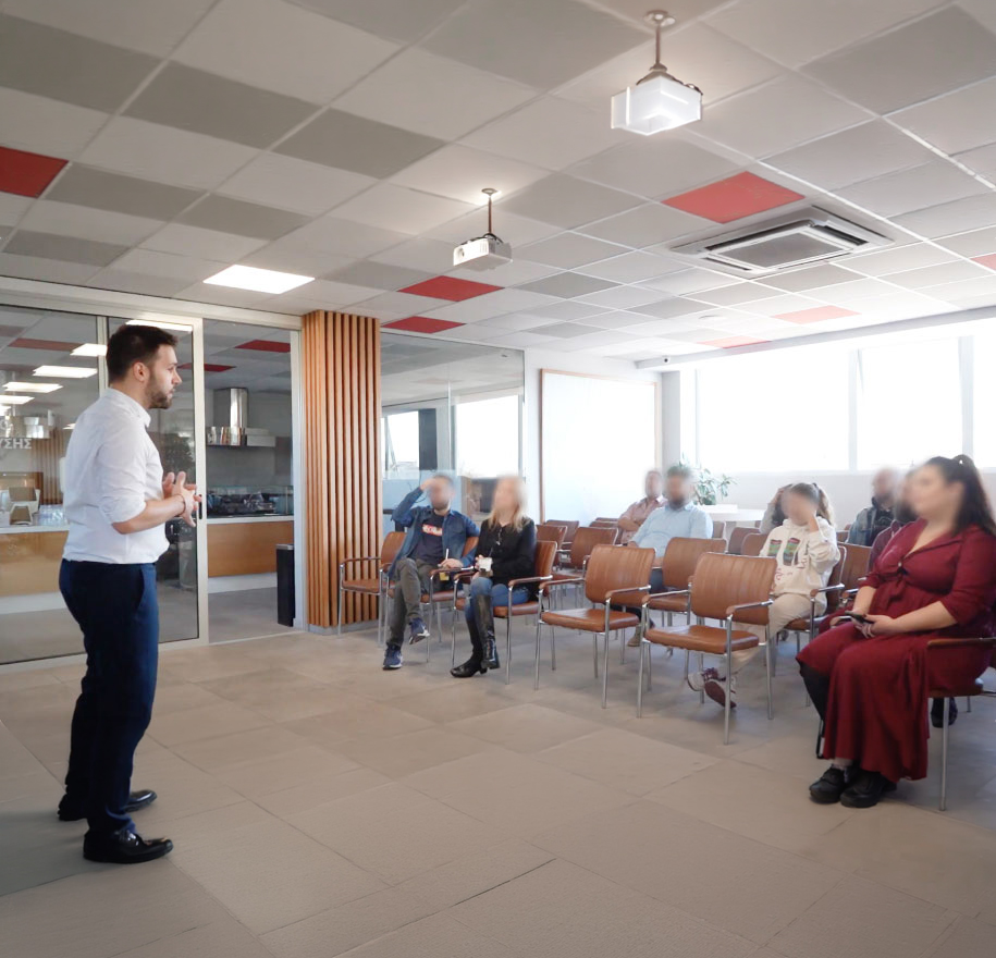 Workshop session with Dimitrios presenting to a group
